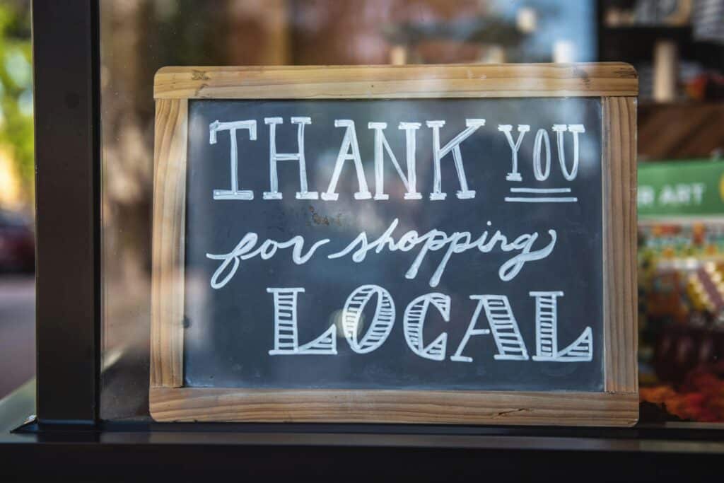 thank you for shopping local written on chalkboard