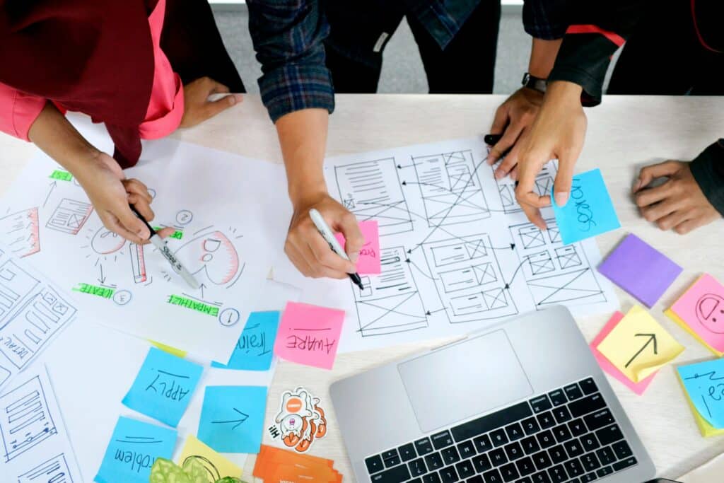 a group of people working on website design and development process