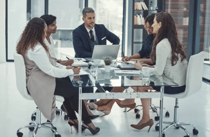 A group of employees having a meeting with their boss. [Branding for Local Business].